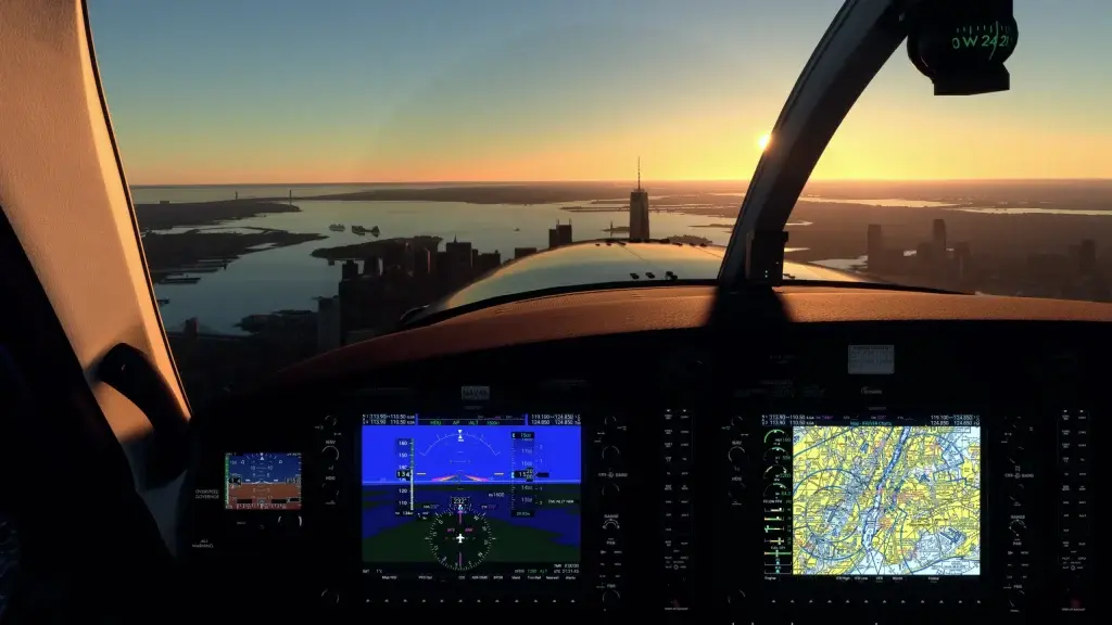 Vista de cockpit ao entardecer sobre uma cidade